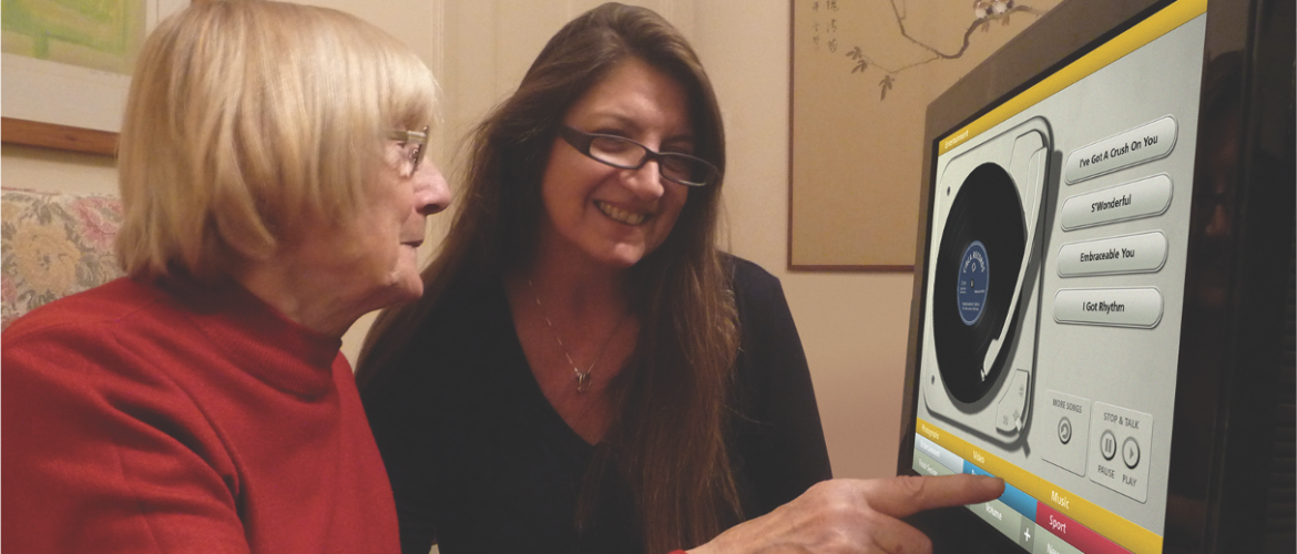 Senior woman and young woman looking at a computer screen