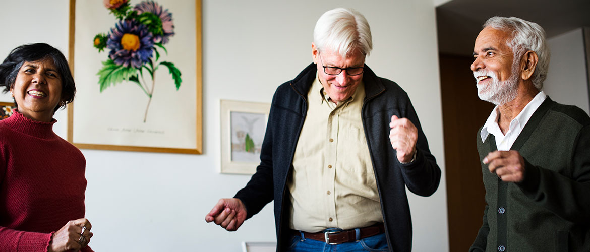 A group of older adults are dancing.