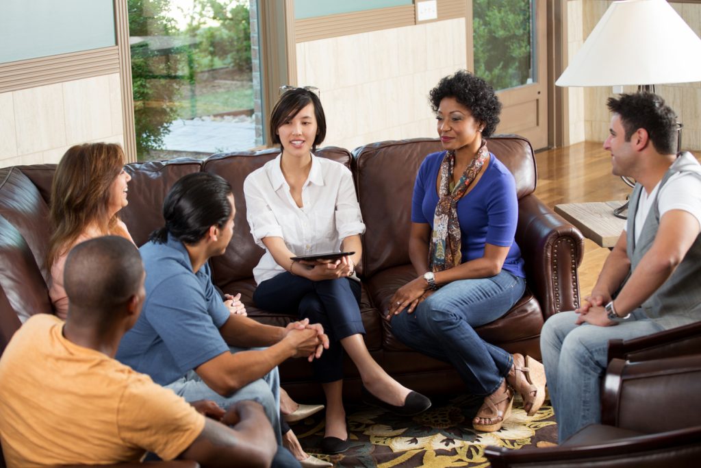 People talking to each other in a support group setting