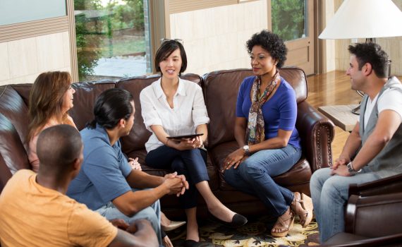 People talking to each other in a support group setting