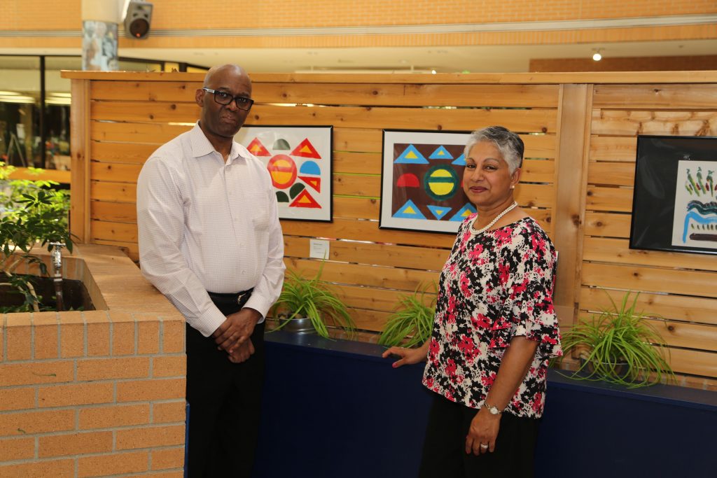 The project lead Renee Climans is standing next to artwork
