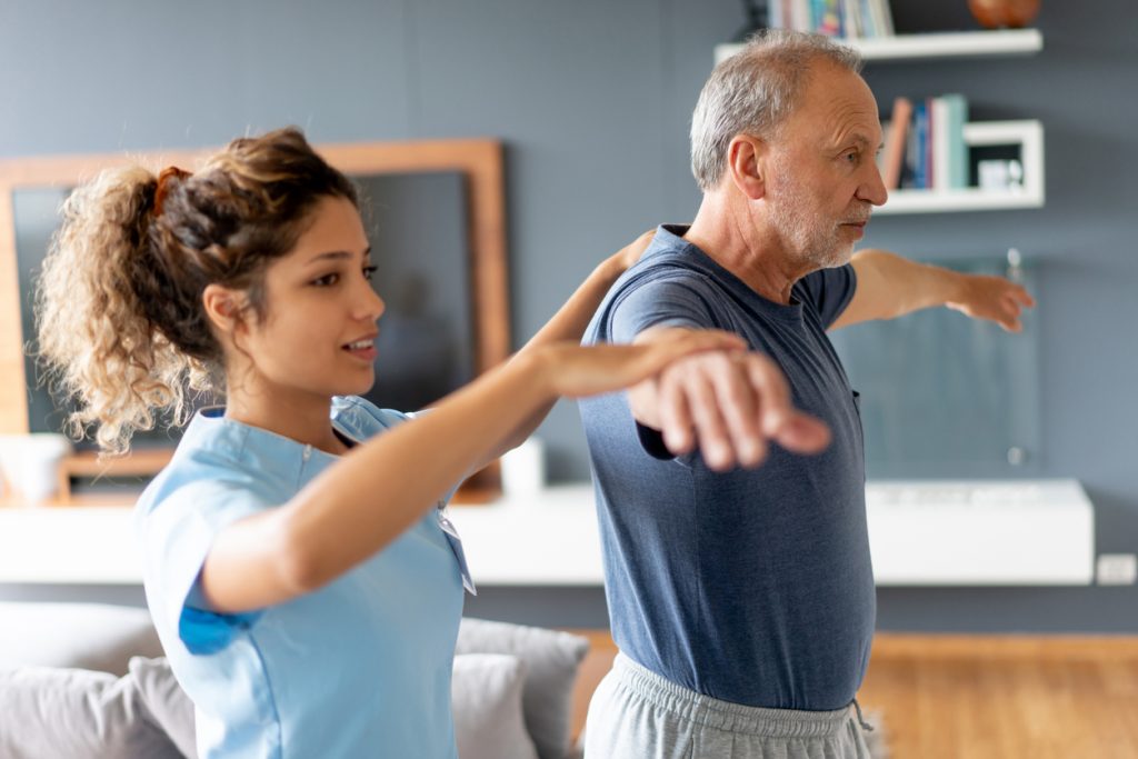 Nurse making a house visit to a senior patient