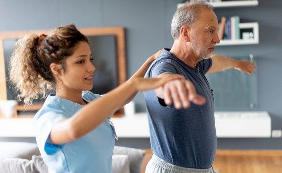Nurse making a house visit to a senior patient