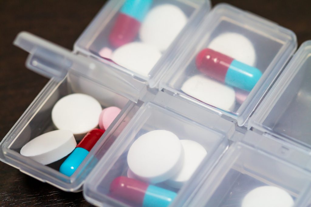 Medication portioned out into a dispenser.