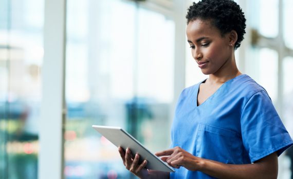 Shot of a young medical practitioner using a digital tablet in a hospital
