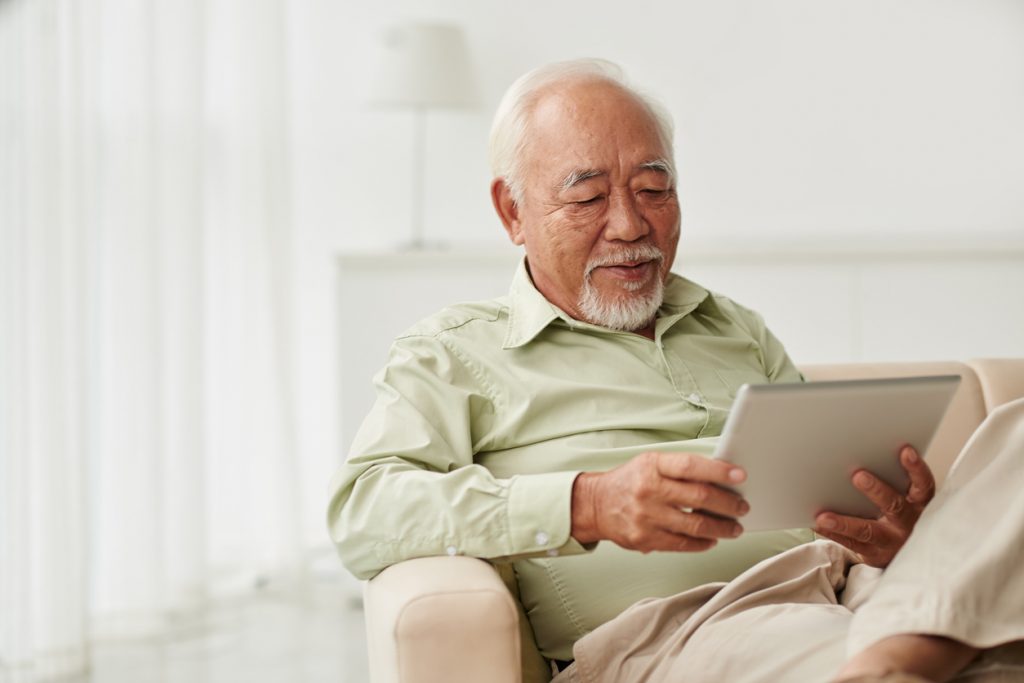 Senior male using a tablet