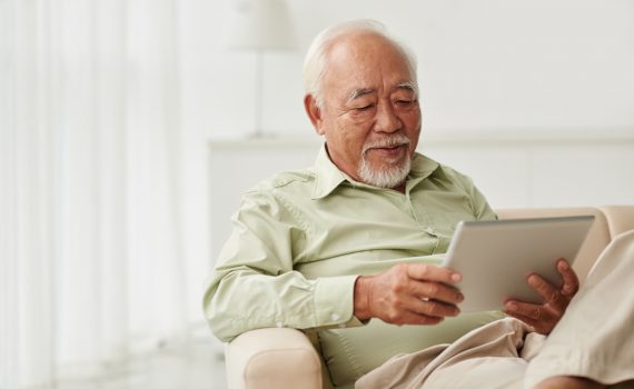 Senior male using a tablet