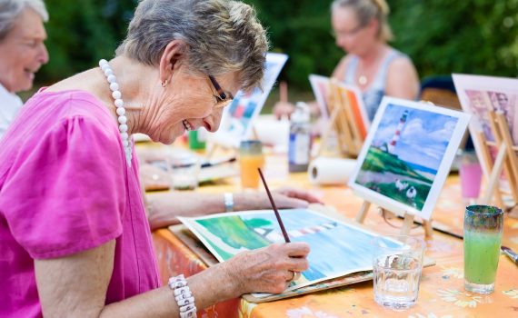 A woman painting a picture.