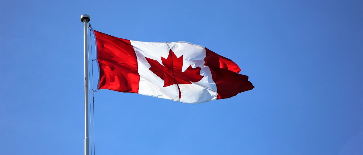 Canadian flag floating in the wind.