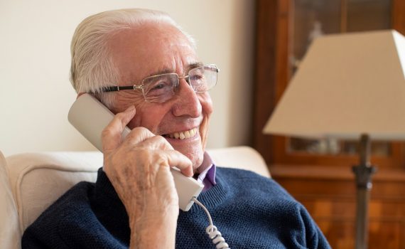Older adult man on the phone.