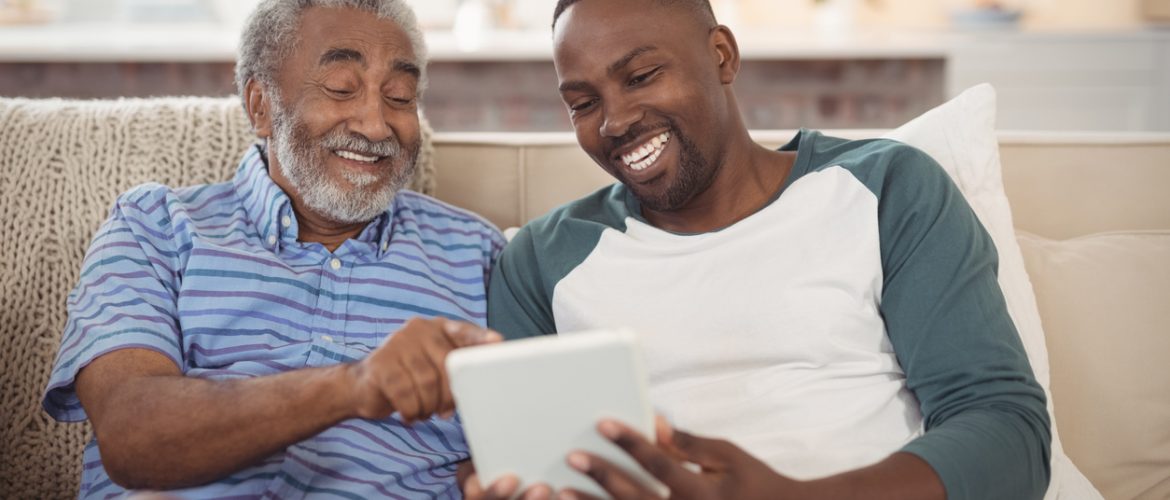 Two men using a tablet
