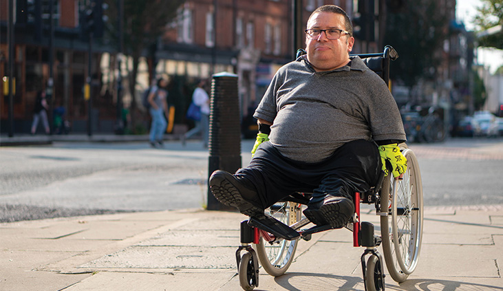 Innovation Themes picture of man in wheelchair on street